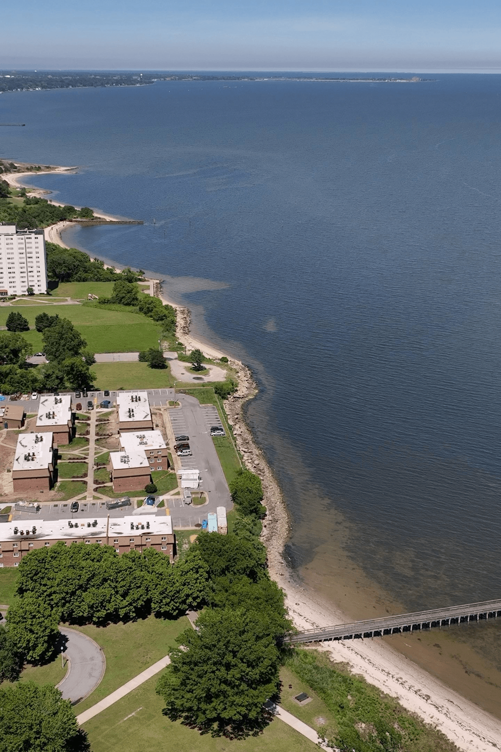 an aerial view of the shoreline of a beach and a body of water