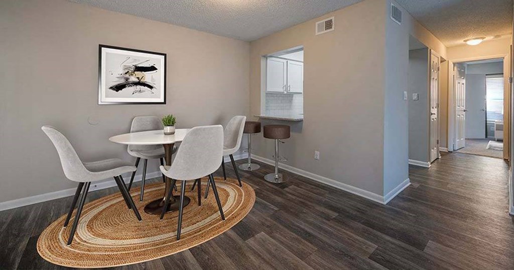 a dining room with a table and chairs