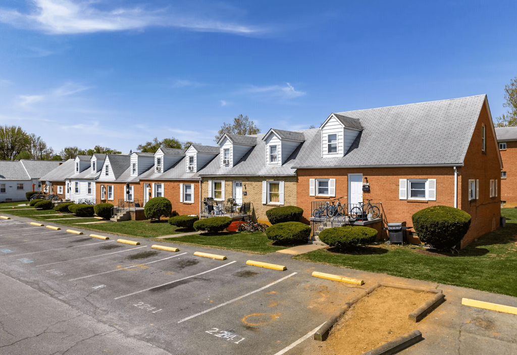 a row of brick houses in a parking lot