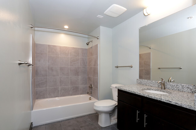 a bathroom with a sink toilet and a bath tub