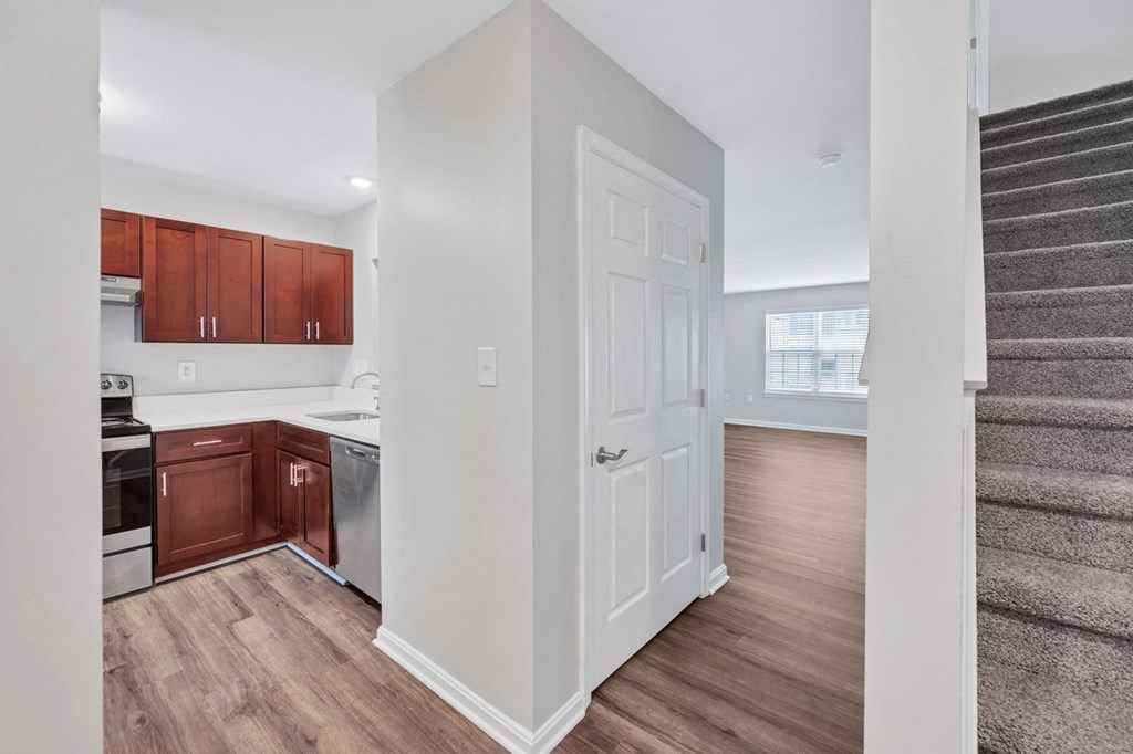a kitchen and stairs in a new home