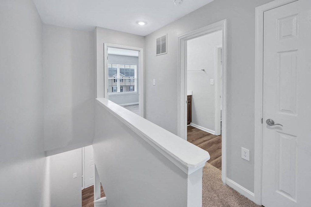 a bedroom with a medium sized bed and a window in a house