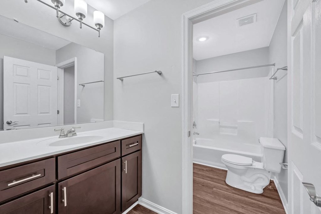a bathroom with a toilet sink and bathtub