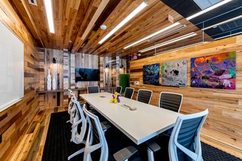 a conference room with a long table and chairs
