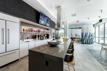 a kitchen with a large center island with a bowl on top of it