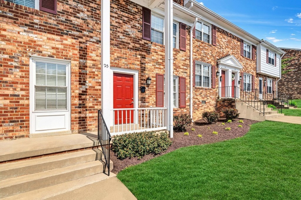 a red door on a brick building