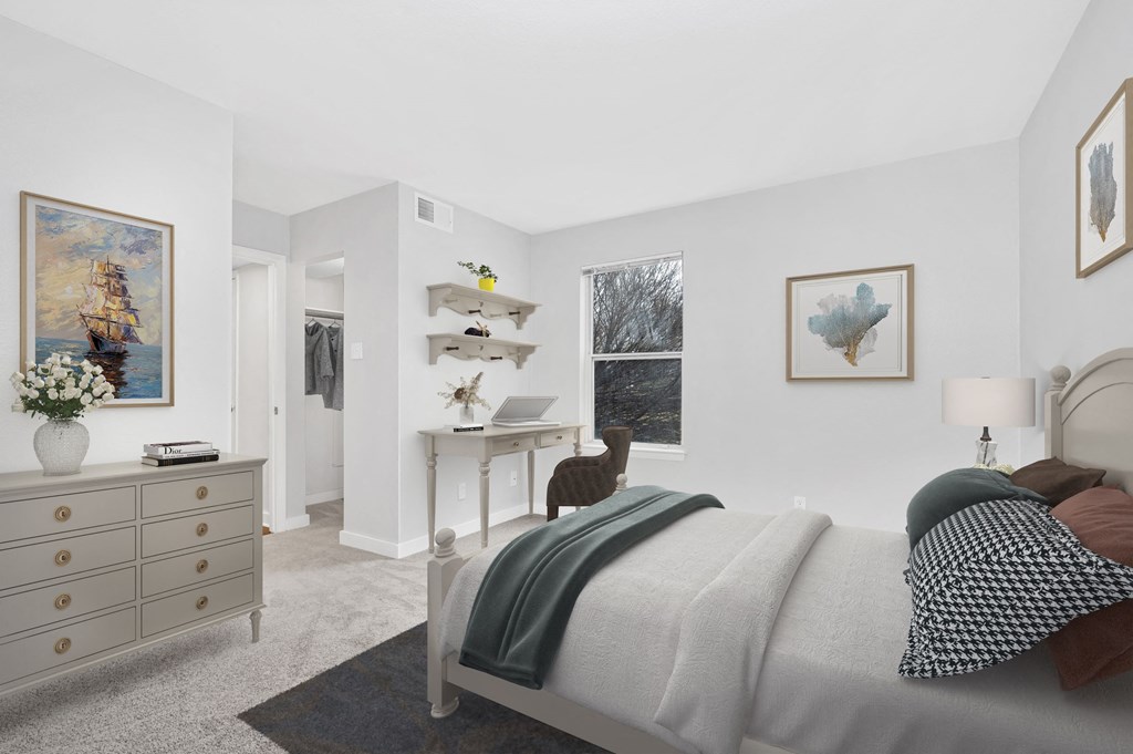 a bedroom with a bed and a dresser