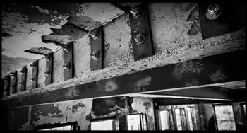 a black and white photo of a building with windows