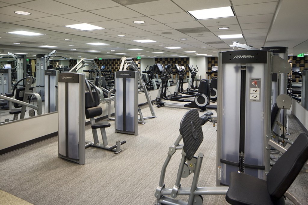 a gym full of exercise equipment at the allegiant convention center