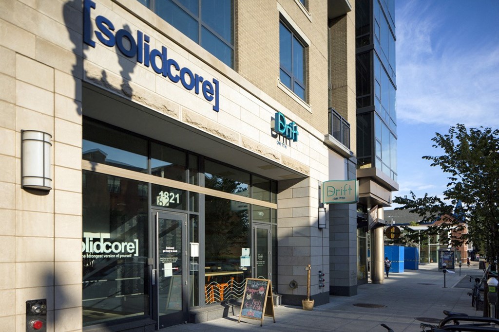 a store front of a building with a sign on the side of it