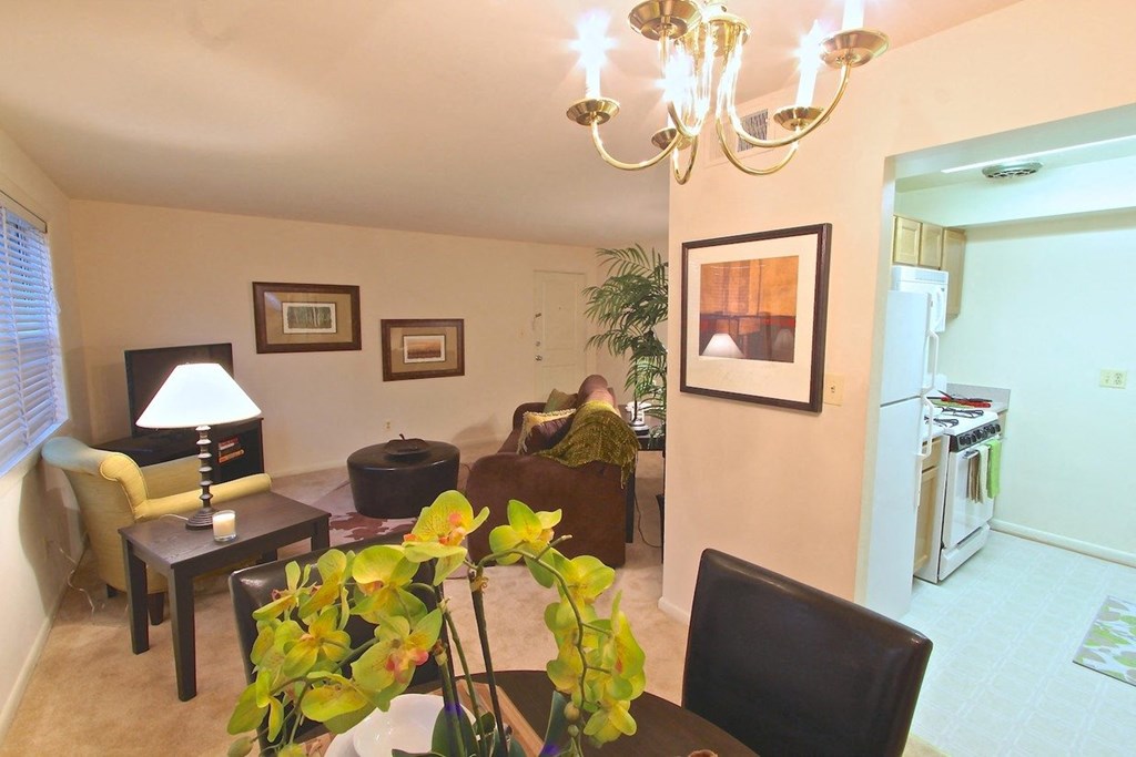 a view of the living room and kitchen from the dining room
