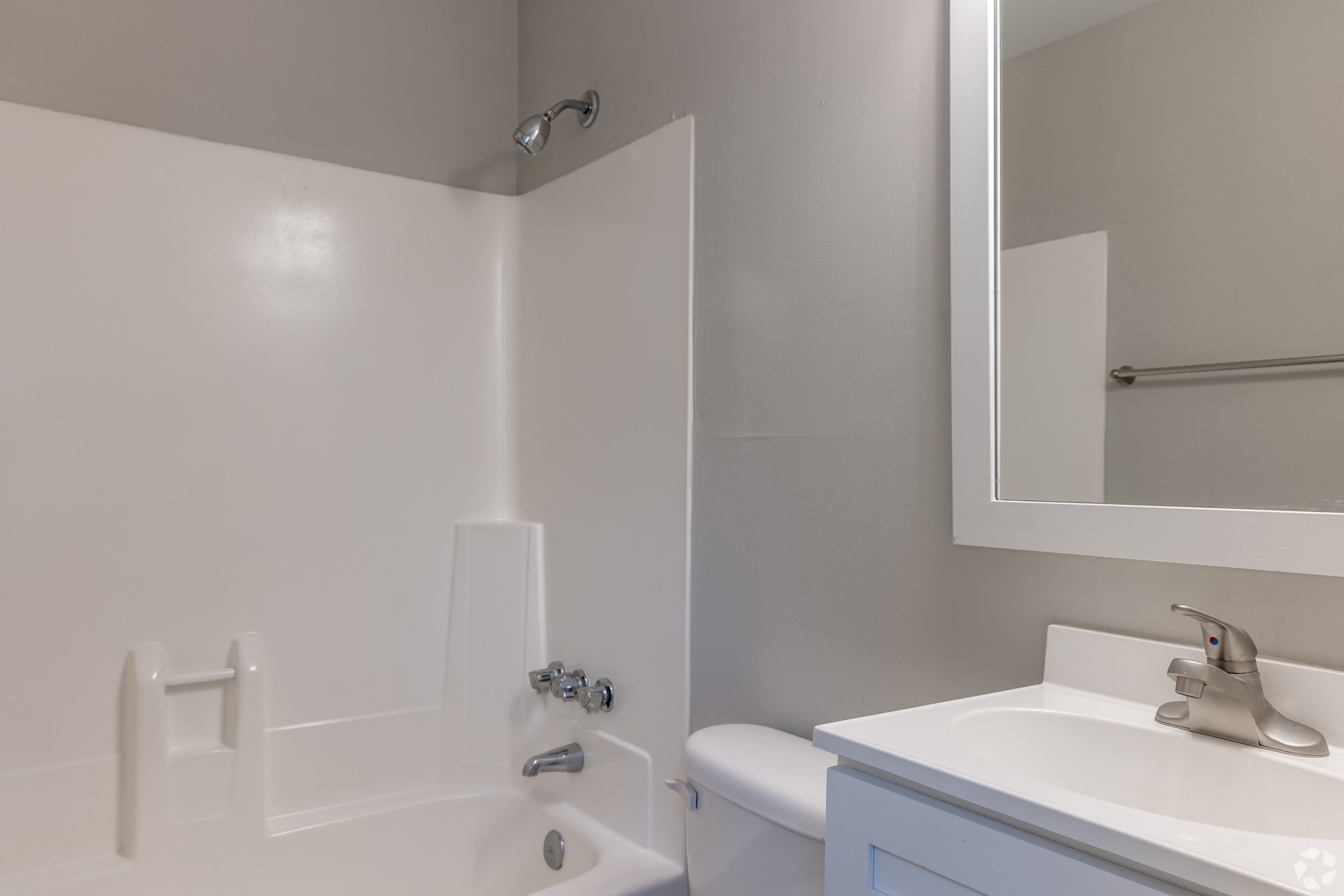 a bathroom with a sink toilet and a bath tub