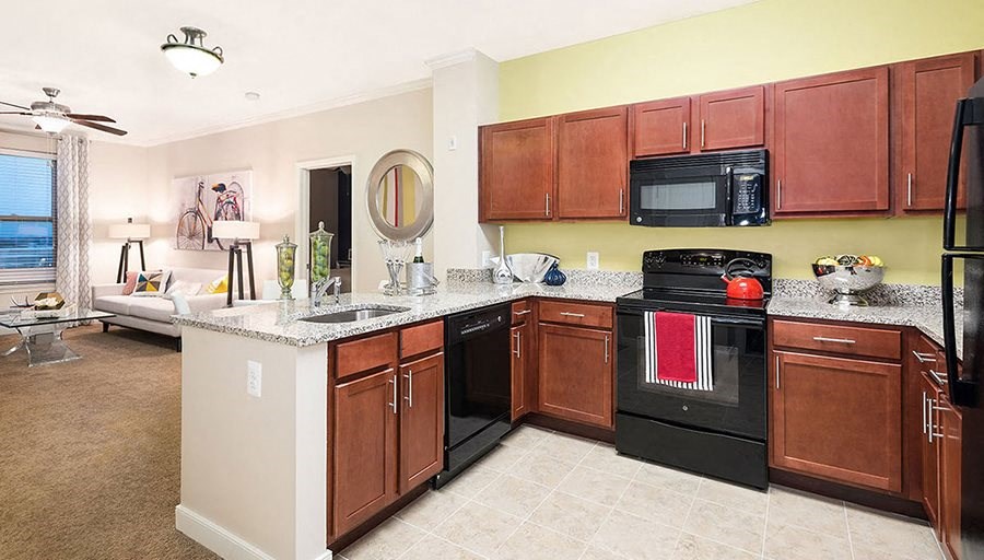 a kitchen with a stove microwave and a sink