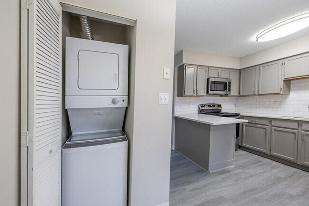 three different views of a kitchen with white cabinets and a counter top