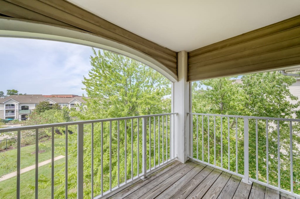 the view from the deck of a home with a balcony