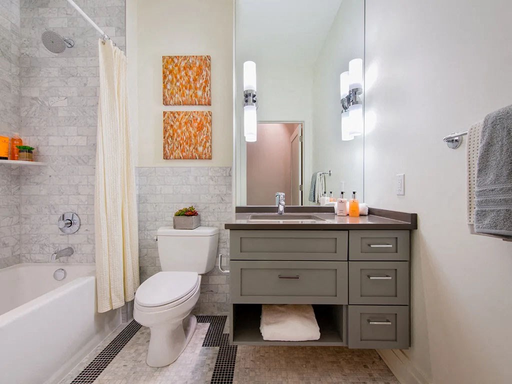 a bathroom with a sink toilet and a shower