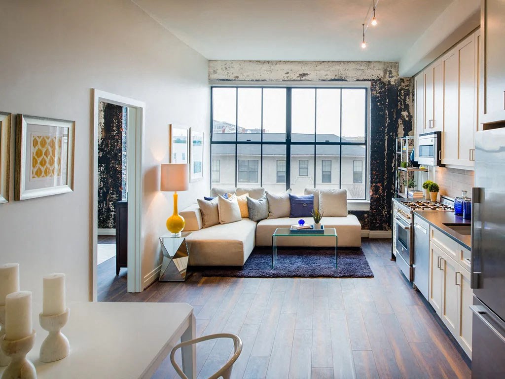 a living room with a couch in front of a window
