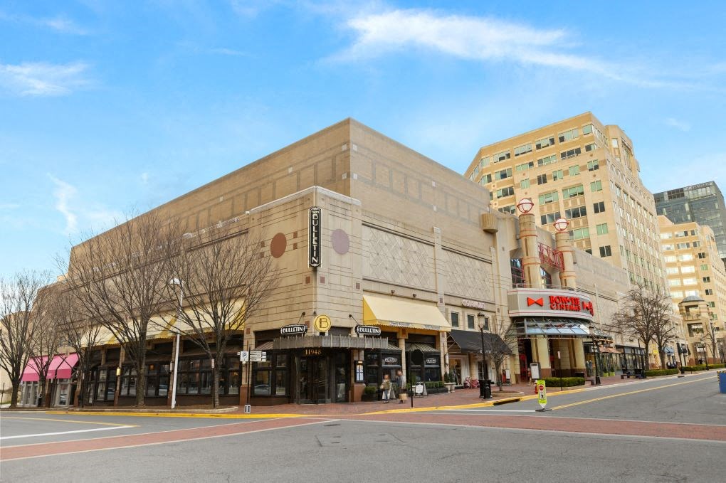 a large building on the corner of a city street