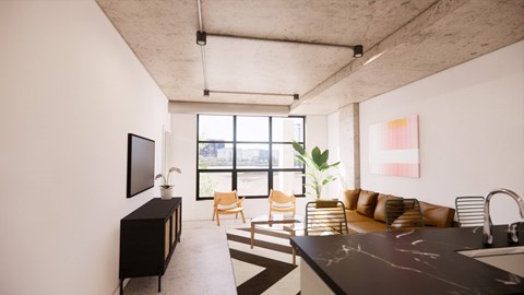 A modern living room with a black countertop and a large window.