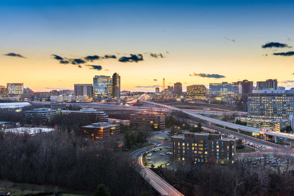 an aerial view of the city at sunset