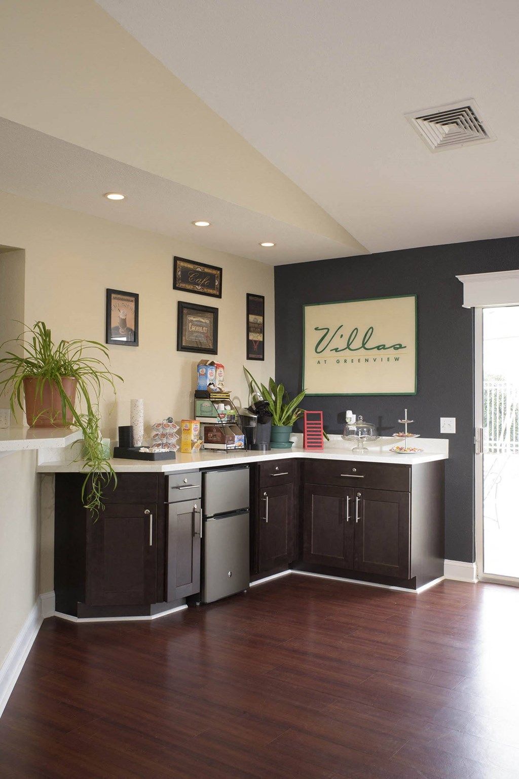a kitchen with a counter and a sink and a window