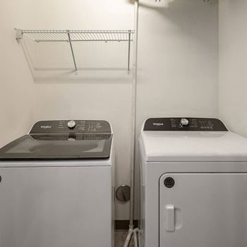a laundry room with a washer and a dryer