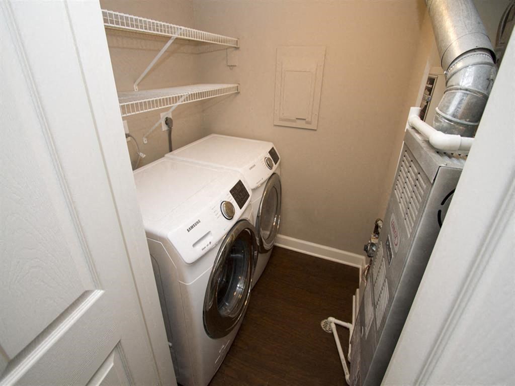a washer and dryer in a small laundry room