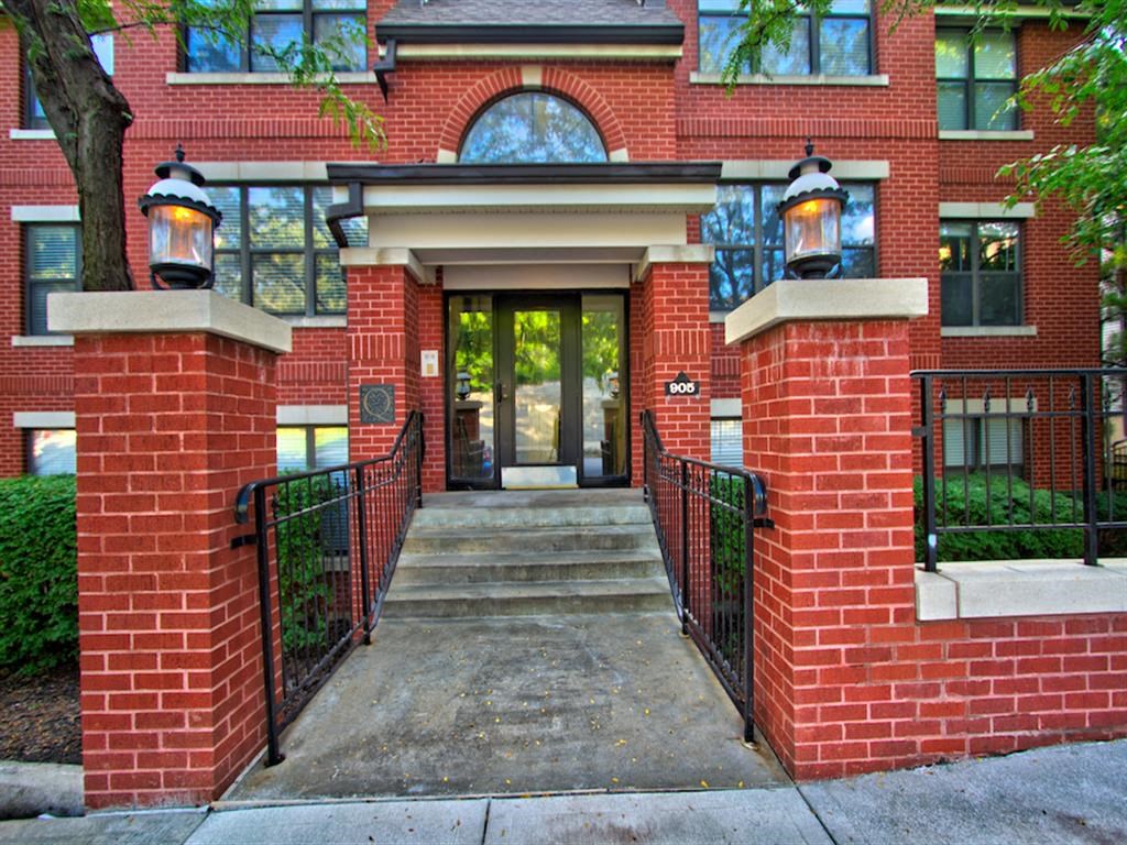 a large brick building with a large glass door
