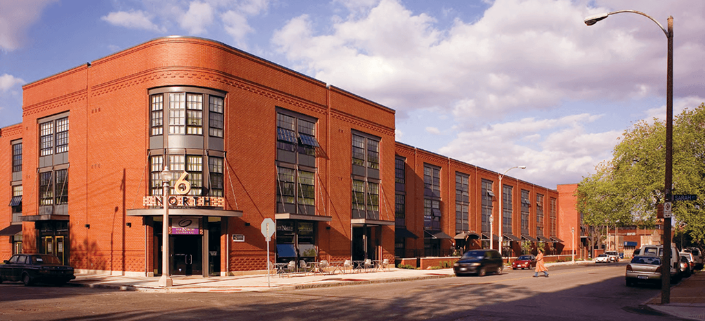 6 North Apartments: a large brick building on the corner of a city street