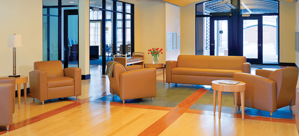 6 North Apartments lobby furnished with yellow couches