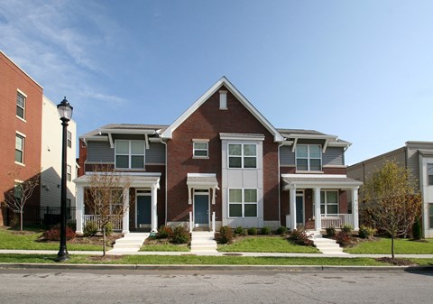 a row of houses on the side of a street