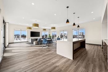 A spacious office with wood floors and a white ceiling.