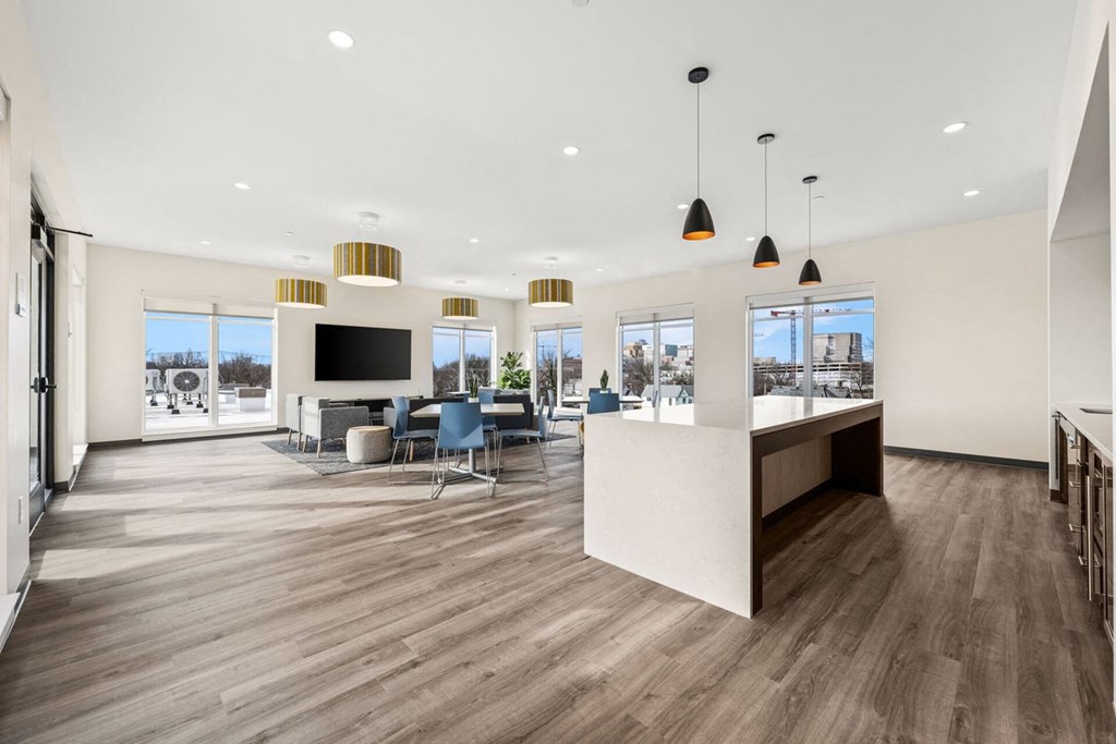 A spacious office with wood floors and a white ceiling.