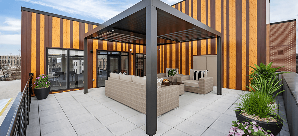 the outdoor patio of Aura at Innovation Square apartments with a pergola