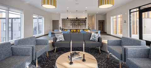 a living room with couches and chairs and a table