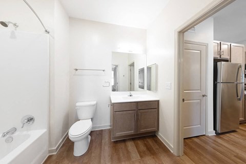 a bathroom with a sink toilet and a mirror