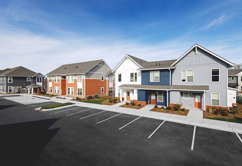 a row of houses in a parking lot