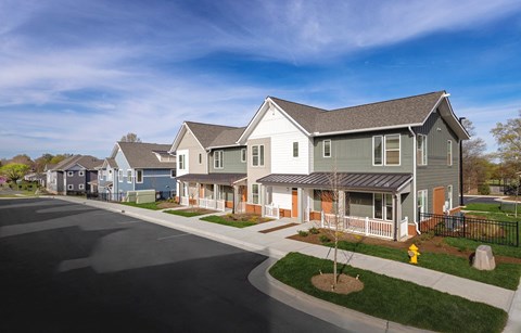 a row of houses on the side of a street