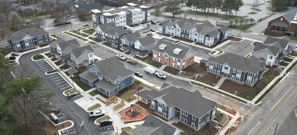 an aerial view of apartment homes in a neighborhood at Brown School Lofts