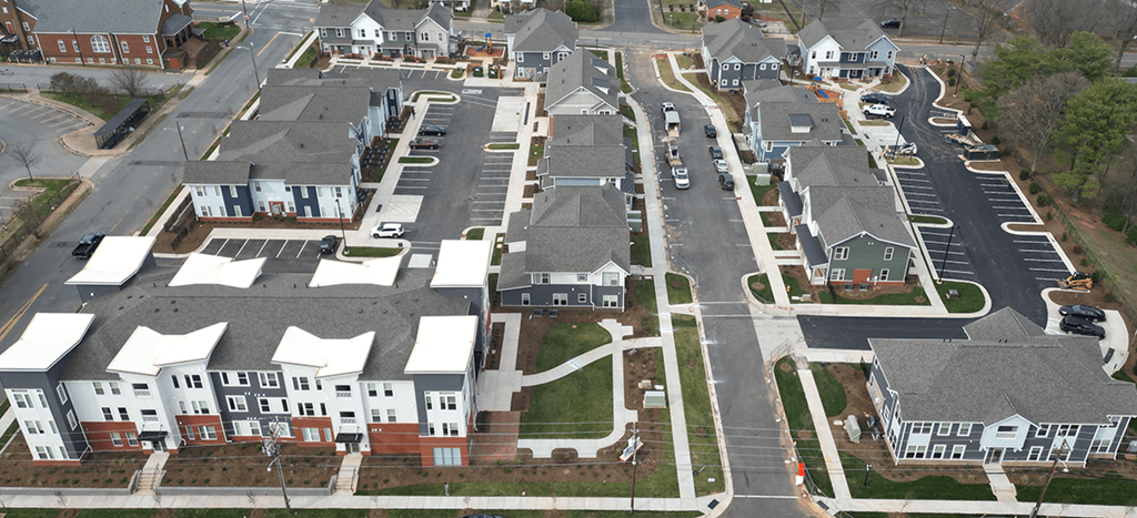 an aerial view of apartment homes in a suburb at Brown School Lofts