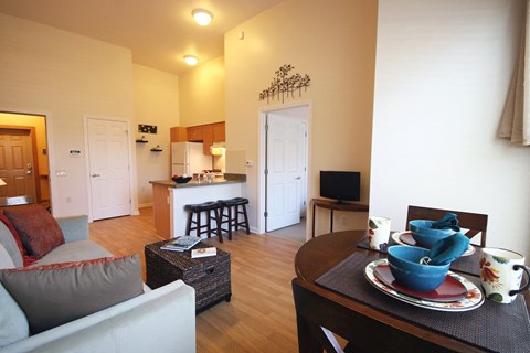 a view of the living room and kitchen from the dining room at Cambridge Senior Living