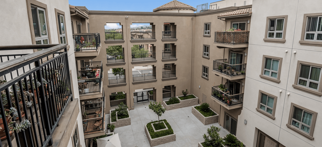 an aerial view of the courtyard of a building with potted plants at Casa Salazar apartments