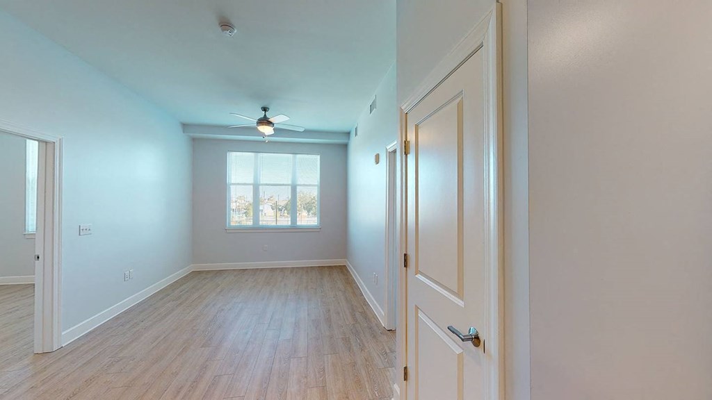 an empty room with a door and a window at City Square 162