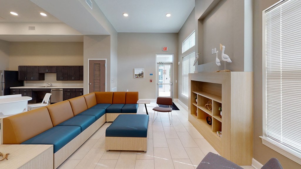 a community room at City Square 162 with couches and a desk