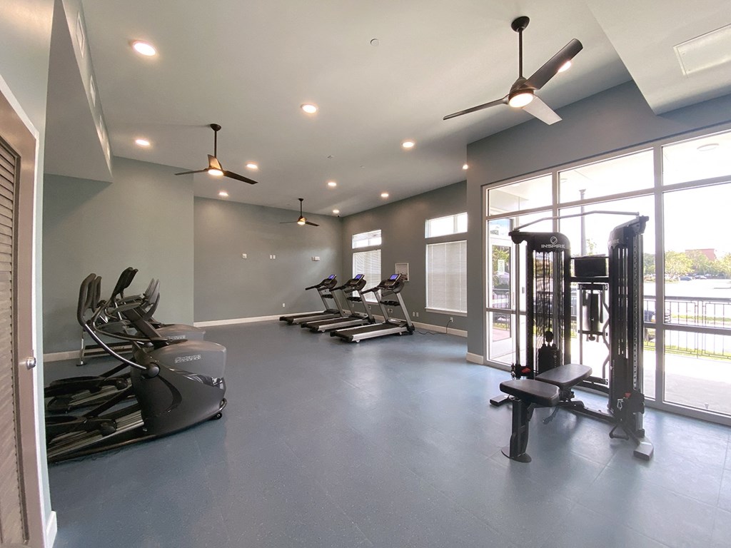 a gym with exercise equipment and windows at City Square 162
