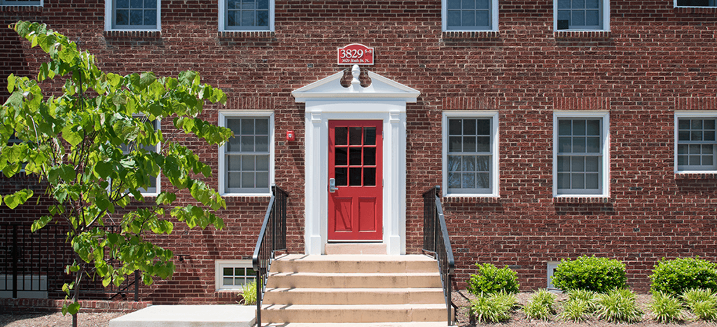 Clarendon Court Apartments Clarendon Court Apartments a two-story red brick building with a red door and windows