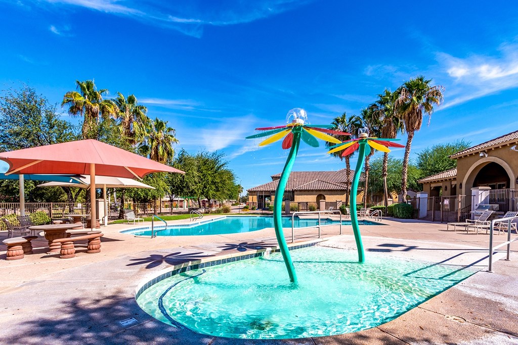 A pool with a blue water and a green pole in the middle.