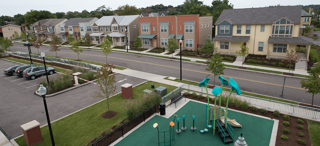 an aerial view of a playground in a neighborhood with houses