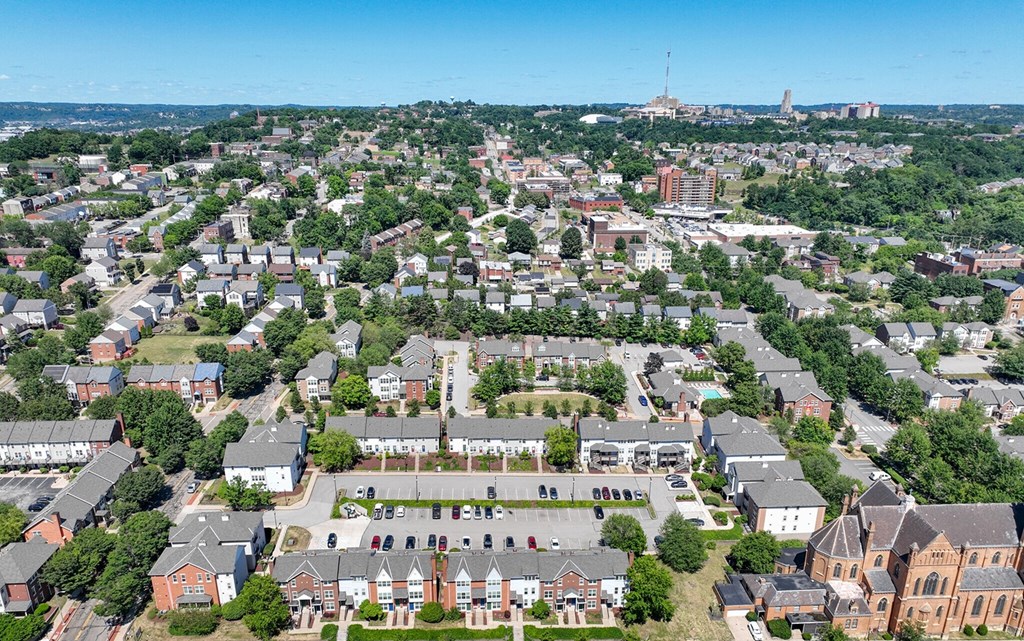 an aerial view of a neighborhood with houses and trees at Crawford Square Apartments & Townhomes