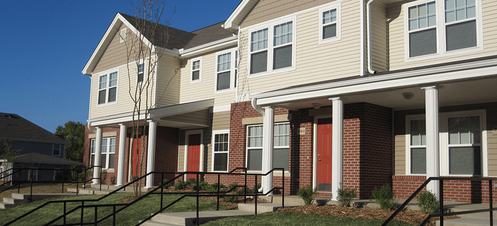 a row of town homes with brick and siding